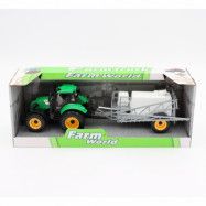 Grön traktor med jordbrukstrailer
