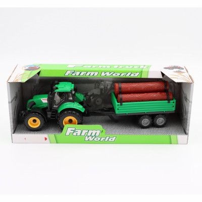 Grön traktor med timmer